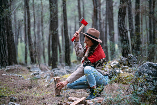 istock Woman Chopping Wood for Campfire 1372077875