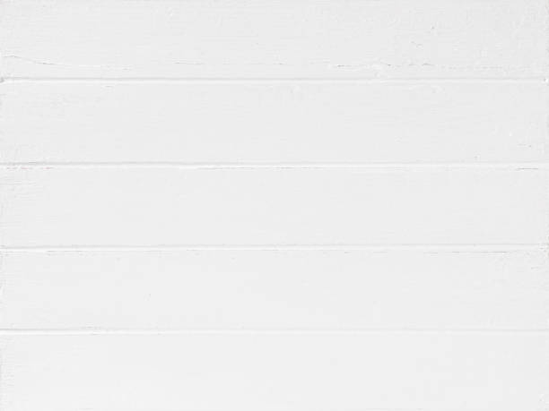 istock Old worn, weathered, white painted wood paneling. 1372079148