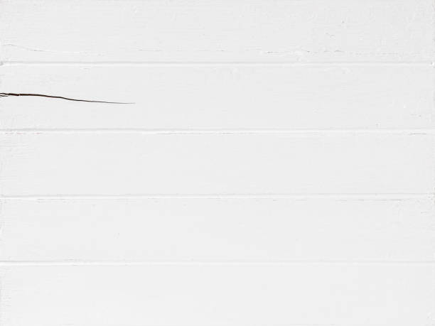 istock Old worn, weathered, white painted wood paneling. 1372079161