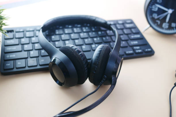 istock call center headphone on laptop on table , 1372080264