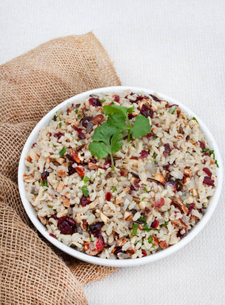 Wild rice pilaf Delicious and healthy Wild rice pilaf with cranberries and pecan nuts pilau rice stock pictures, royalty-free photos & images