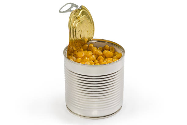 istock Canned sweet corn in open round tin can, side view 1372086055