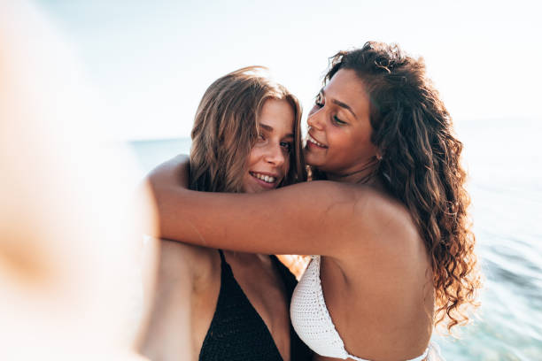 istock friends take a selfie at the beach 1372088303