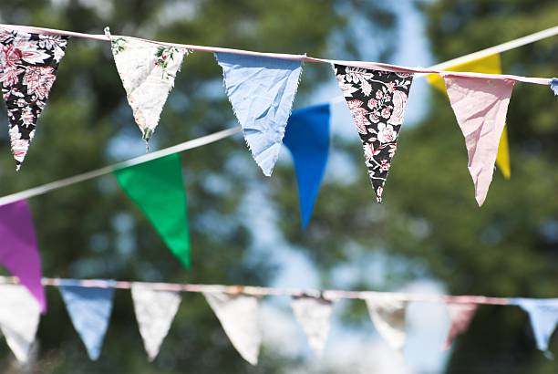 istock Colorful bunting with patterned fabric strung up outside 137208952