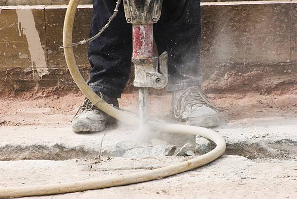 Jackhammer 1 . Construction worker using pneumatic drill repairing metrolink in Manchester. britain british audio stock pictures, royalty-free photos & images