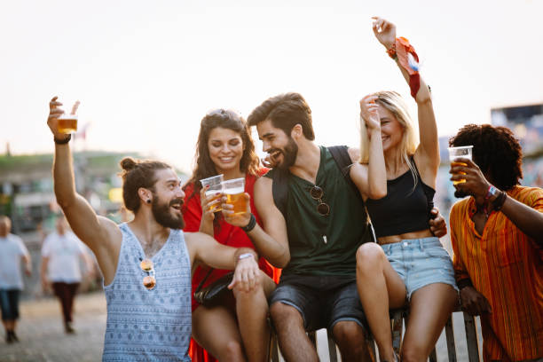 istock Happy young people attending festivals at summer having fun 1372089758