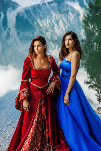 Two beautiful brunette princesses at a picturesque lake setting in Northern Italy