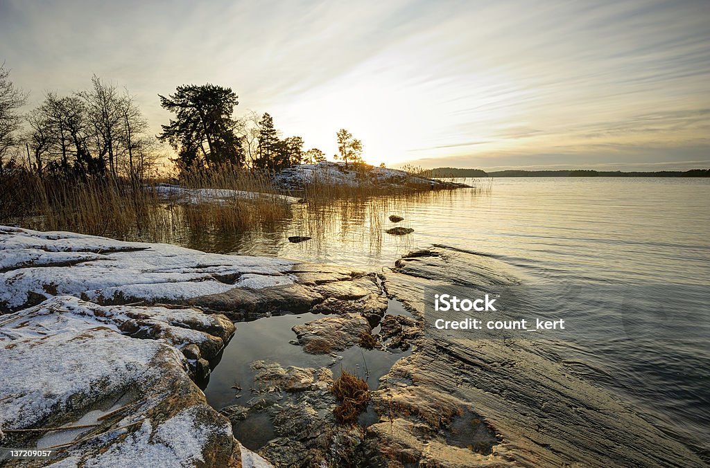 Atardecer de invierno en Finlandia - Foto de stock de Agua libre de derechos