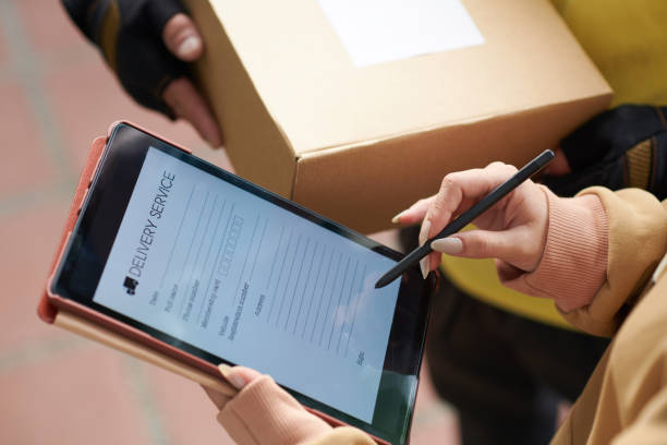 istock Woman signing for getting the parcel 1372094211