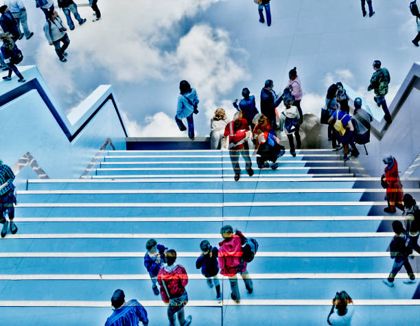 Shot of group of people superimposed over a staircase. Success concept.