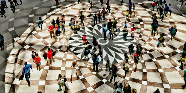 Shot of unrecognizable people walking on a town square.