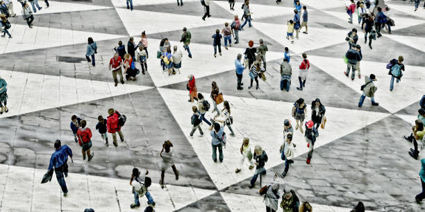Shot of unrecognizable people walking on a town square. The city is Stockholm, Sweden.