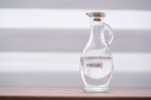 white vinegar on wood table top - vinegar imagens e fotografias de stock