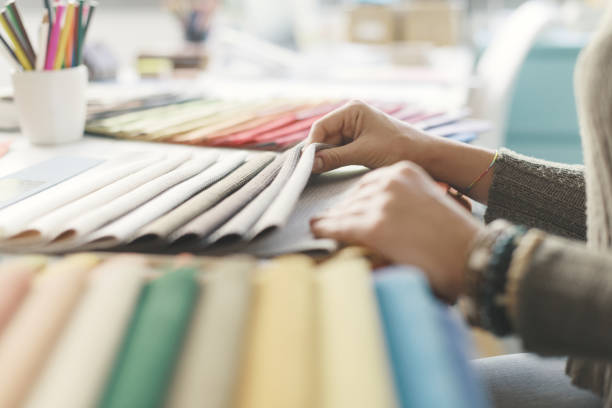 istock Professional decorator picking fabric swatches 1372098227