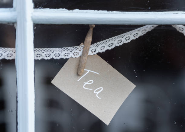 istock Tea sign pegged to lace in shop window 1372098233