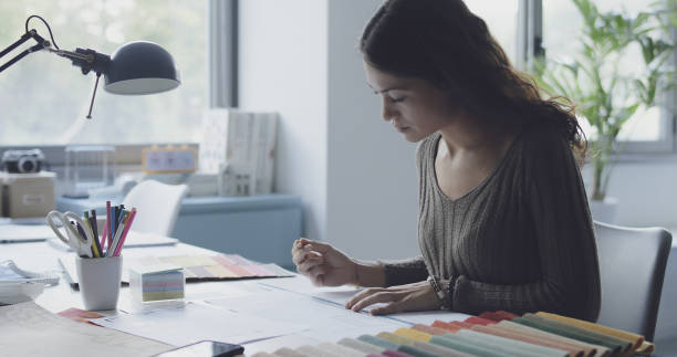 istock Professional interior designer sitting at desk and working 1372098374