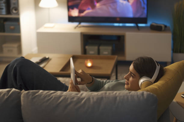 istock Young woman connecting with her tablet 1372099341