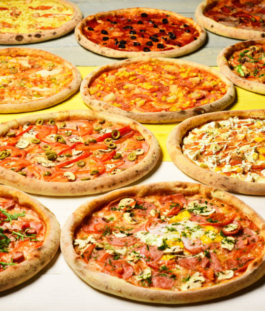istock Pizza circles with meat, mushrooms, tomatoes and cheese 1372100134