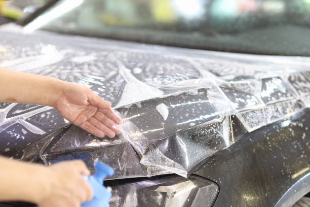 Specialist in car wrapping by car wrapping with vinyl film or film stock photo