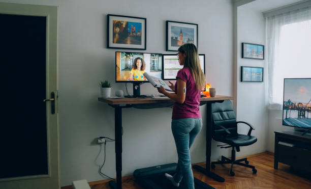 istock Standing desk home office with under desk treadmill 1372102026