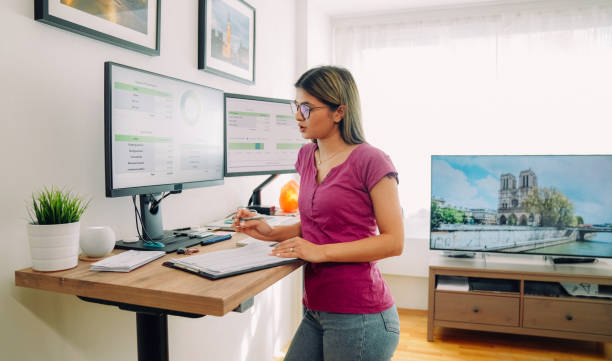 istock Woman working at standing desk 1372102152