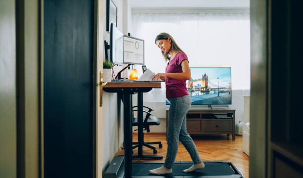 istock Standing desk home office with under desk treadmill 1372102269
