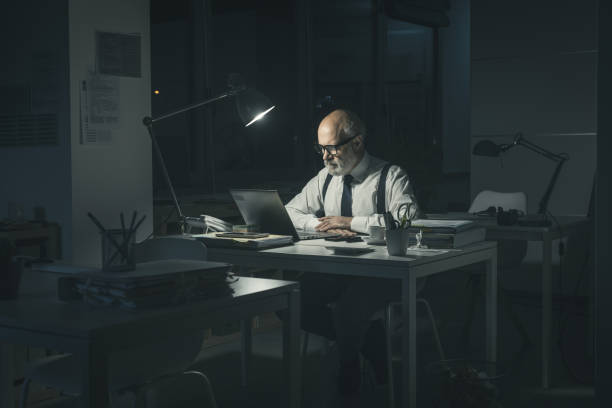 istock Businessman working overtime in the office 1372103445