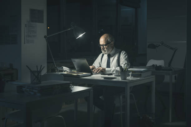istock Businessman working overtime in the office 1372103531