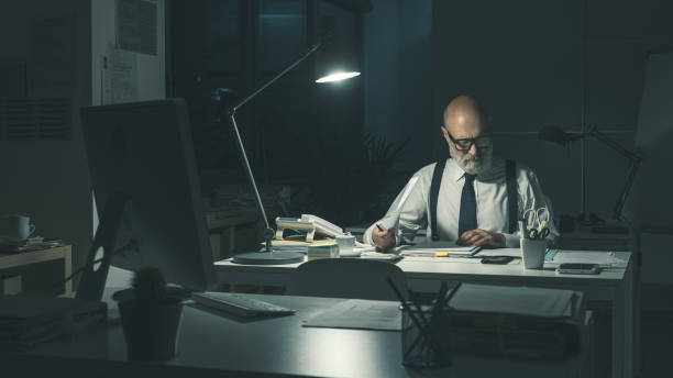 Corporate businessman working late at night