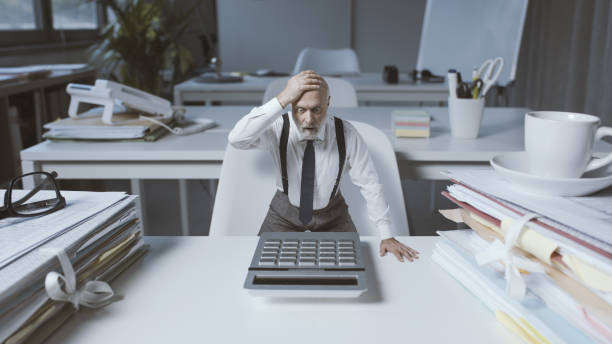 istock Shocked businessman checking expenses and costs 1372104202