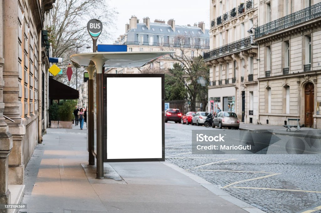 Bus stop with blank billboard A bus stop in a city with a blank advertisement placard Billboard Stock Photo