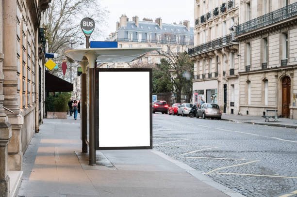 bus stop with blank billboard - paris street imagens e fotografias de stock