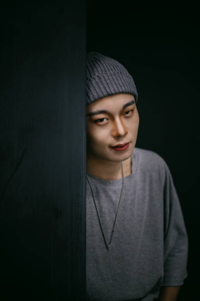 istock Asian handsome young men leaning against the door 1372106256