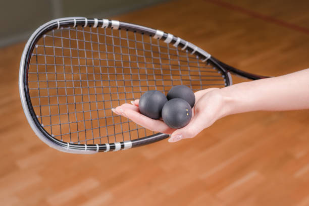 istock Image of racket and three squash balls. Sports concept. 1372107144