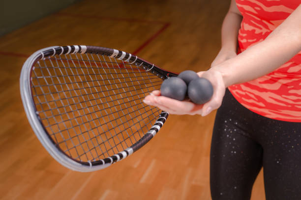 istock Image of racket and three squash balls. Sports concept. 1372107149