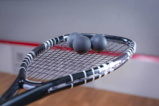 istock Image of racket and three squash balls. Sports concept. 1372107193