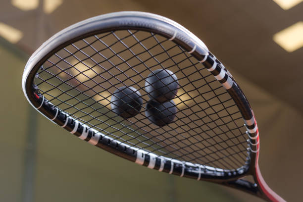 istock Image of racket and three squash balls. Sports concept. 1372107194