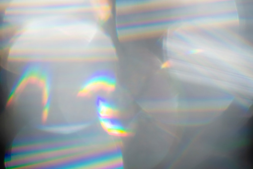 Rainbow Lens. Optical glare effect of objective lenses. Defocused blur reflection of rainbow sunbeams.