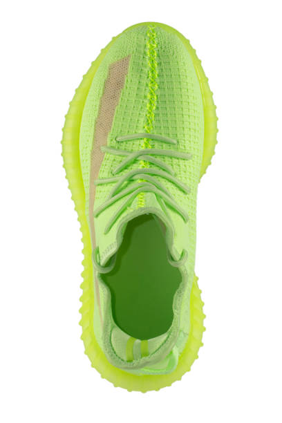istock Green rag sneaker top view on a white background. 1372107676