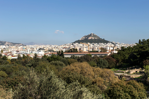 Panoramic view of the city of Athens, Old Agora and Lecavitos hill in the evening (Greece)