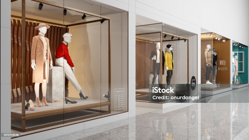 Facade Of Clothing Stores With Mannequins Displaying In Showcase In Shopping Mall Shopping Mall Stock Photo
