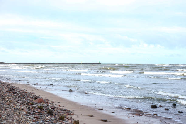 istock Coastal shore view with baltic sea and rocks on sand. 1372113757
