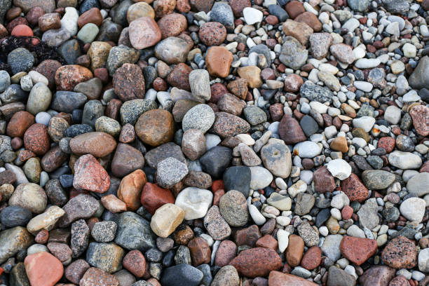 istock Close up photography view with small and large rocks on a beach. 1372113791