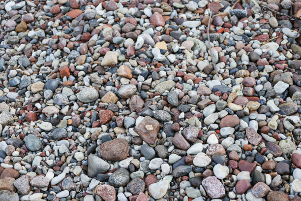 istock Close up photography view with small and large rocks on a beach. 1372113793