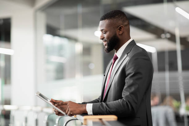 istock African american man CEO using business mobile app on tablet 1372114916