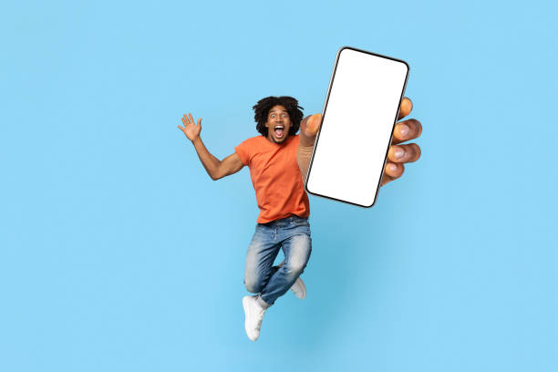 istock Modern smartphone with blank screen in excited man hand 1372115058
