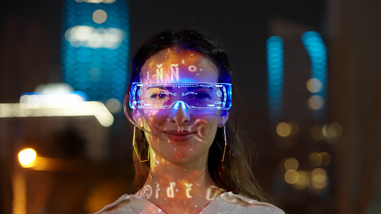 Young woman wearing augmented reality glasses.