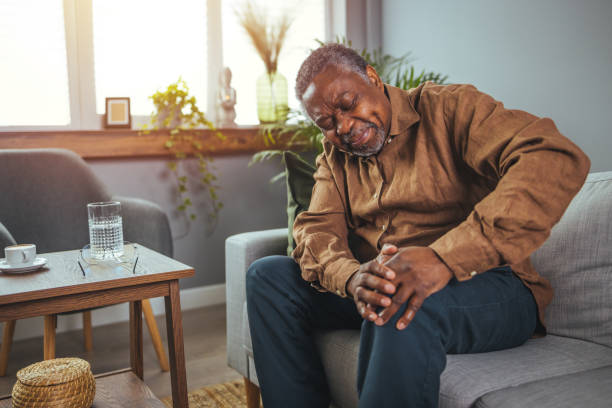 istock Mature man massaging his painful knee. 1372115371