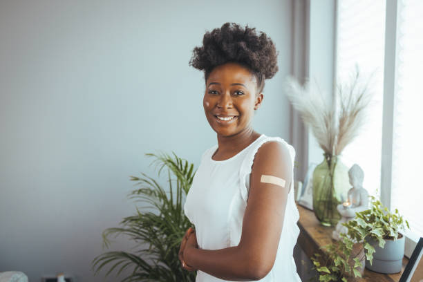 istock Black female getting vaccine dose against covid 1372116138