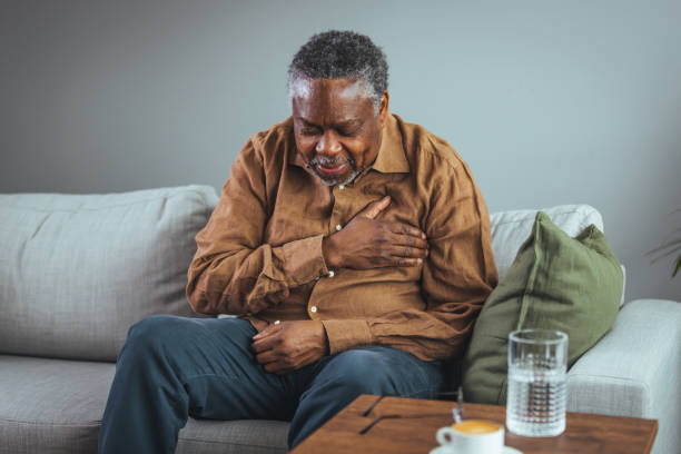 istock Senior man who suffers, shrinks and has difficulty breathing 1372116314